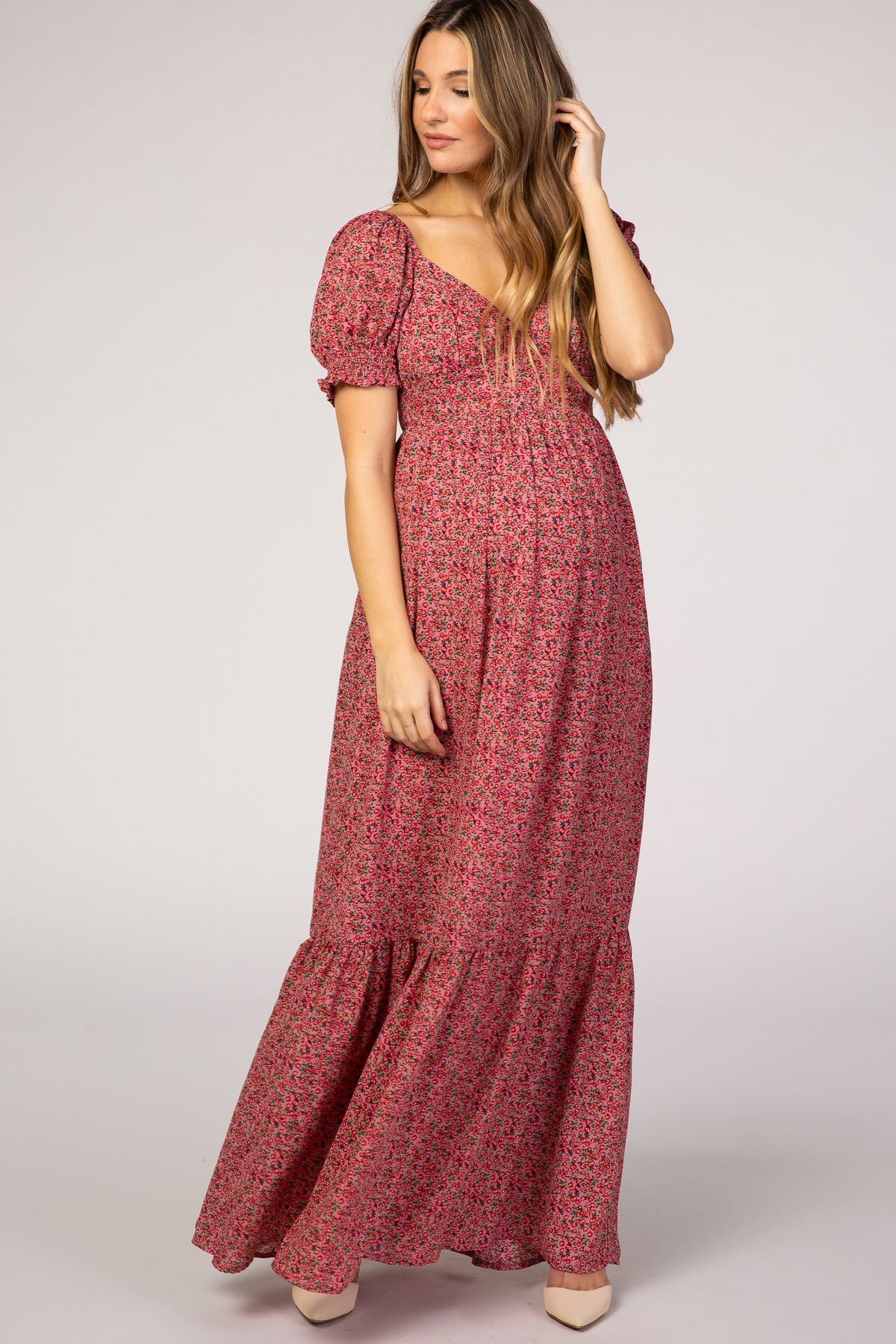 Pink floral maternity maxi dress with puff sleeves and a long flowing skirt