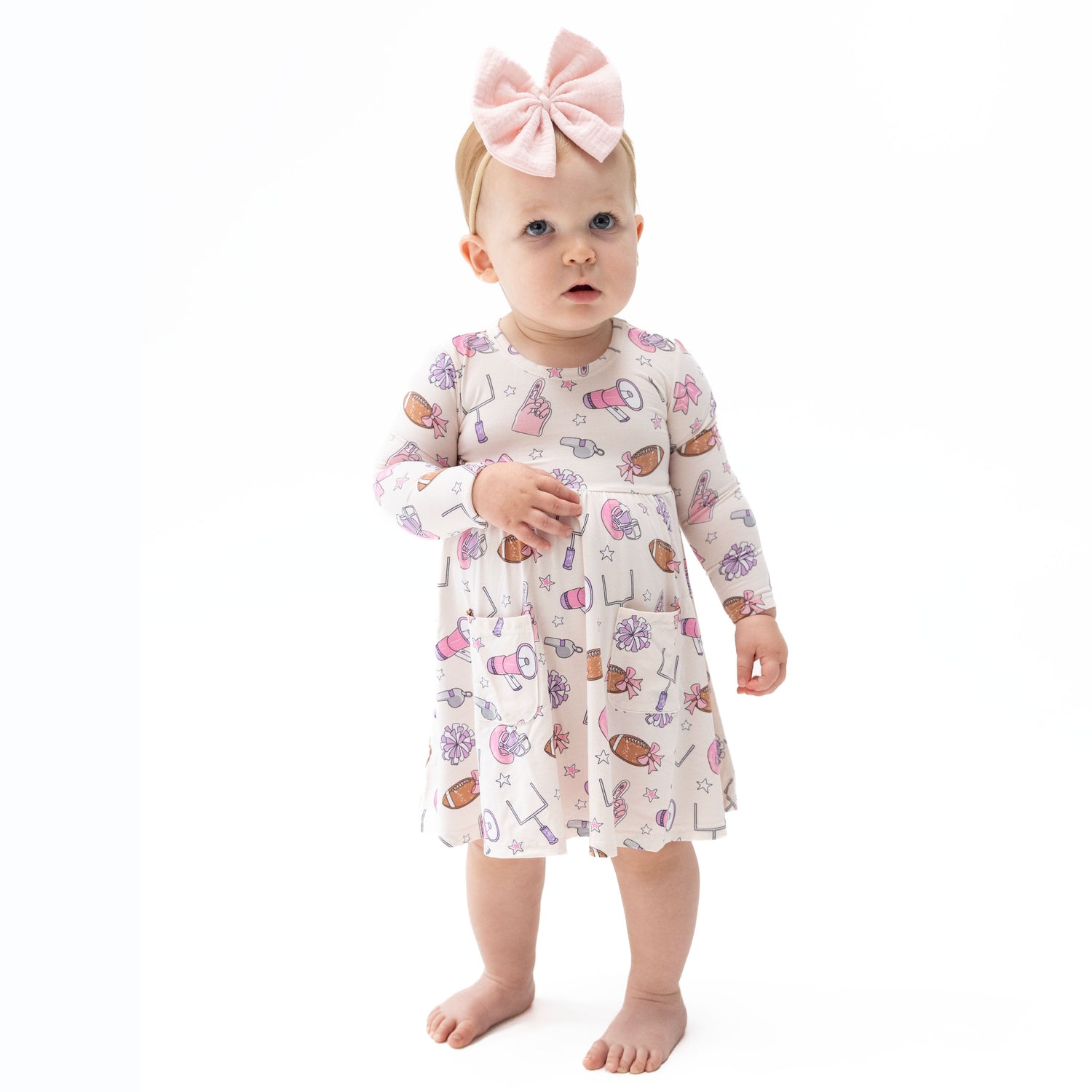 Long sleeve twirly dress with football print and matching bike shorts