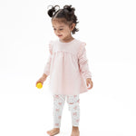 Two-piece set with pink long sleeve ruffle-shoulder tunic featuring a bow applique and matching ribbed leggings
