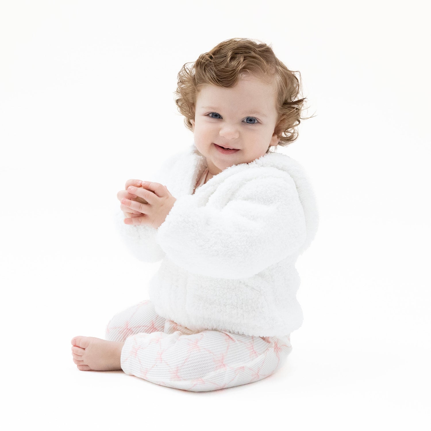 White chenille hooded baby jacket with soft textured fabric