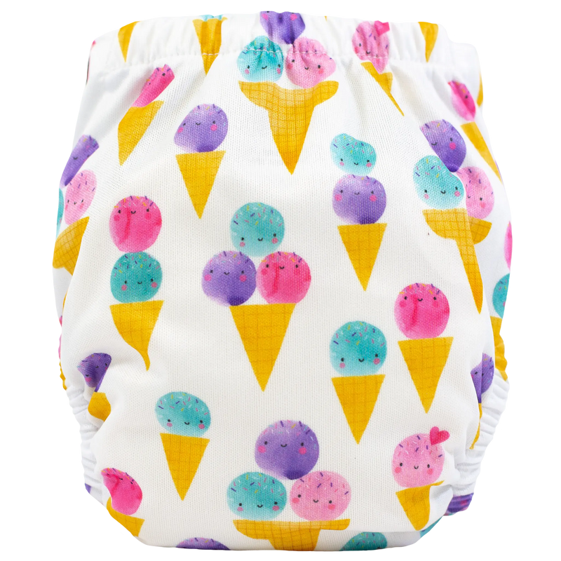Tiny Tushies Newborn AIO cloth diaper with colorful ice cream cone print.