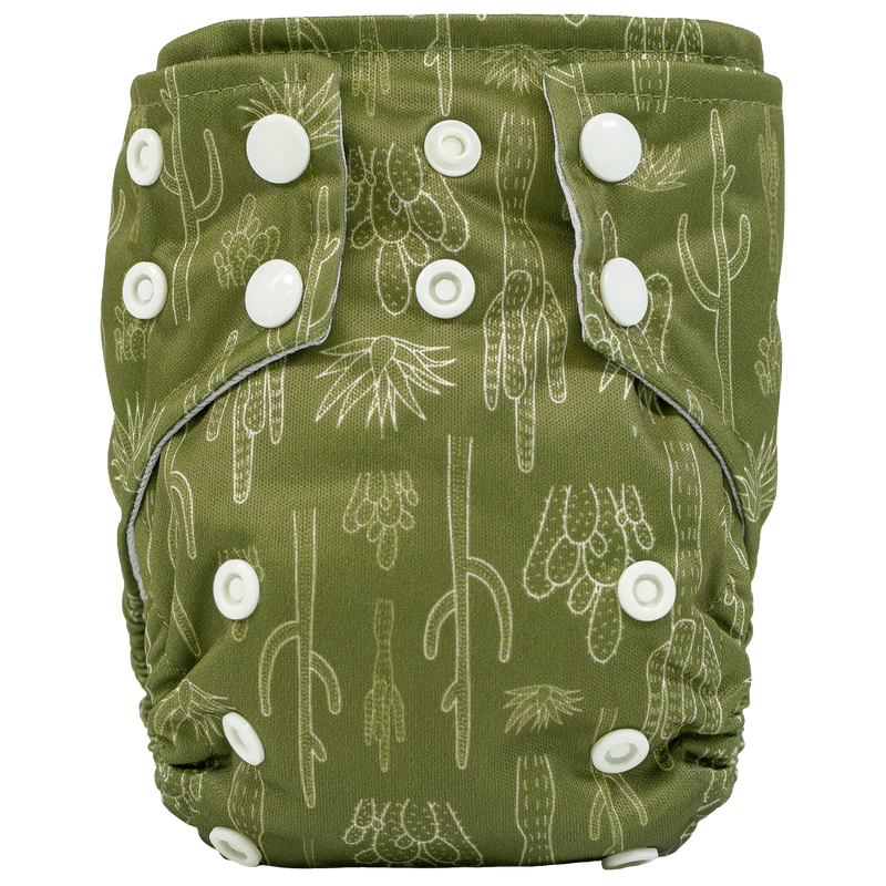 Tiny Tushies Newborn AIO cloth diaper in green with cactus print and adjustable snaps.
