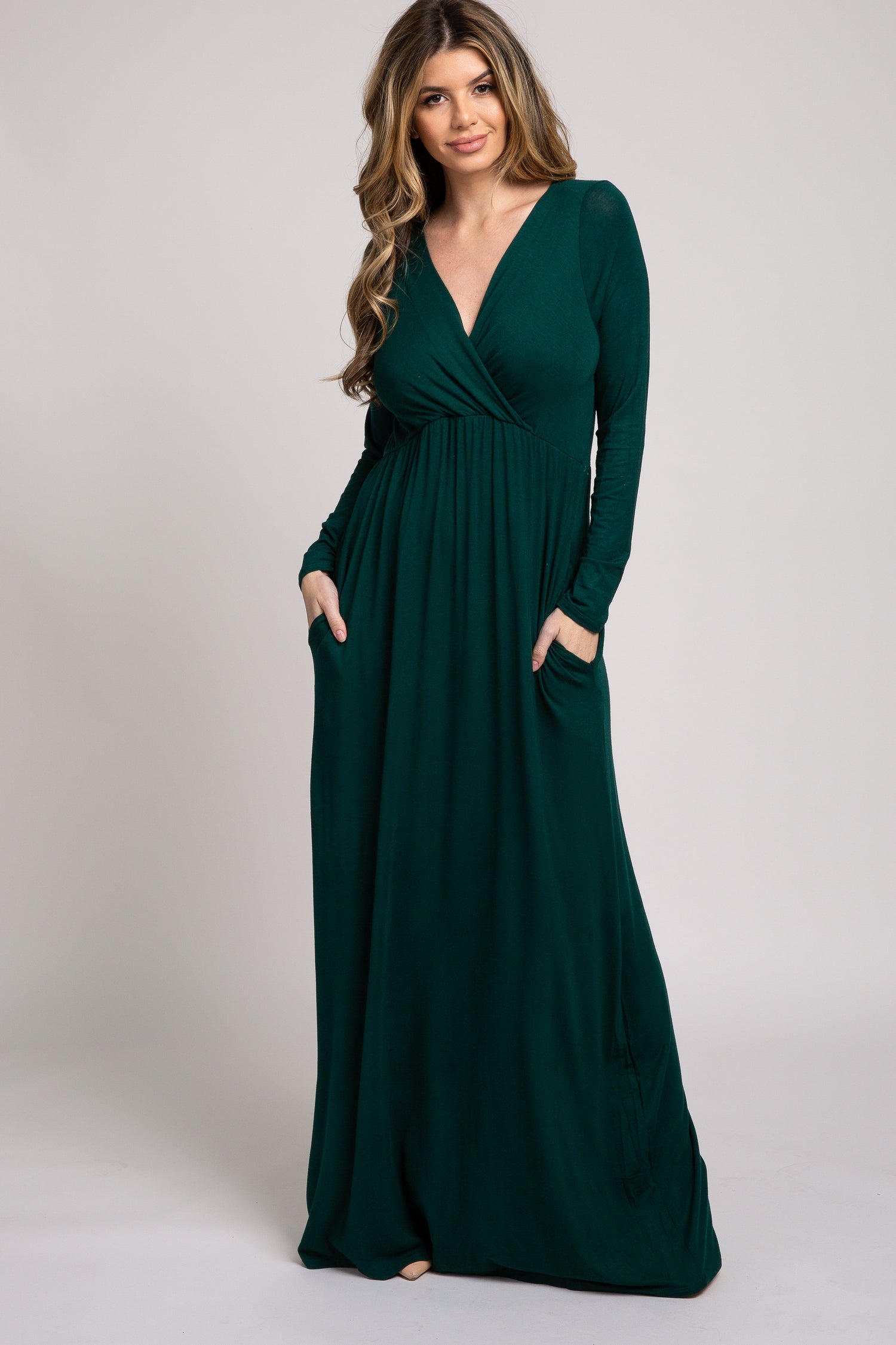 Green long sleeve maxi dress with a v-neckline in a solid single hue.