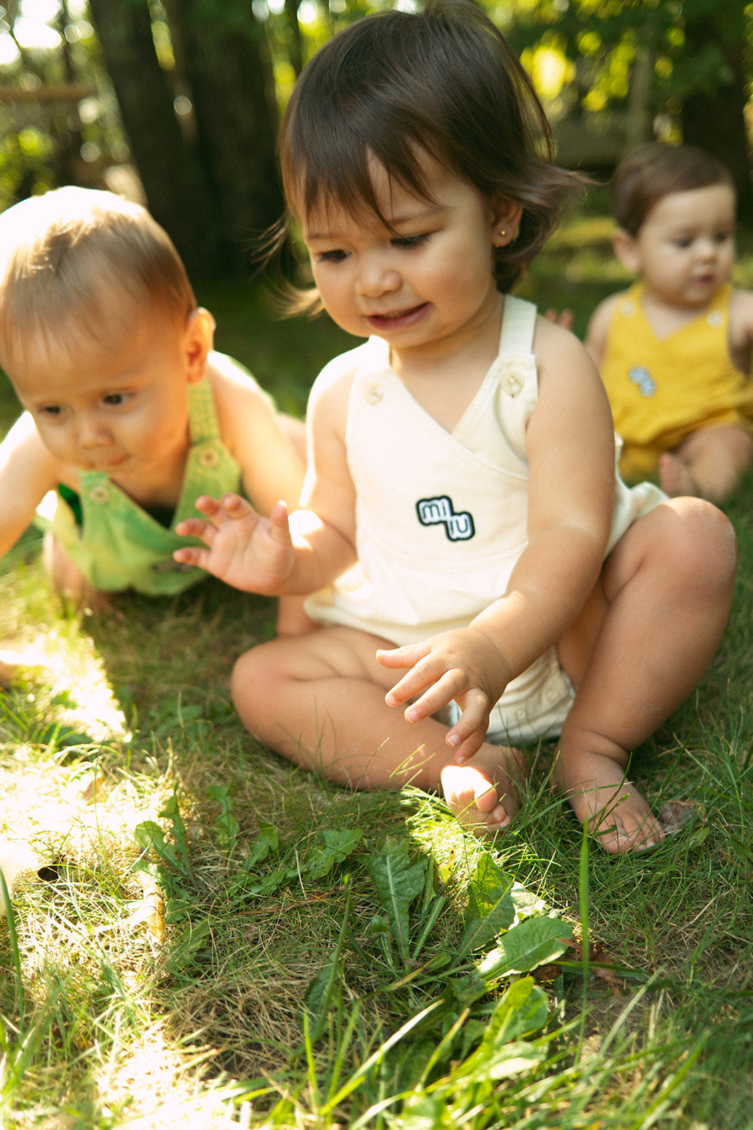Raine Bubble Natural Crossover Romper With Button Patch