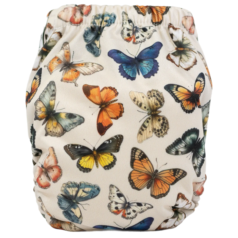 Tiny Tushies Newborn AIO Cloth Diaper with butterfly print, fits 5-20 lbs, trim fit, AWJ material.
