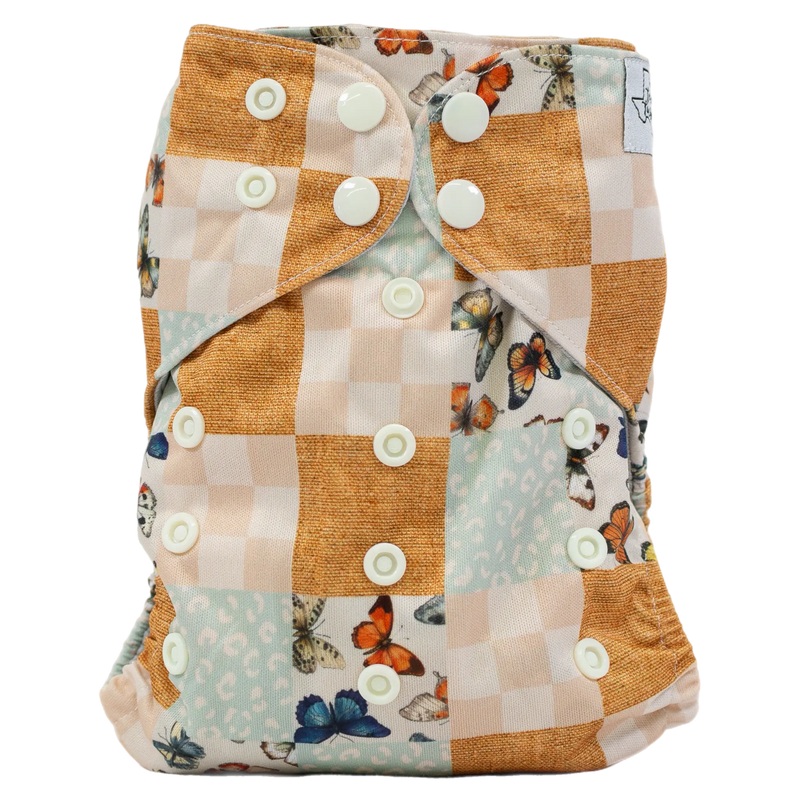 Slim Fit Pocket Cloth Diaper with butterfly and checkered design, featuring adjustable snaps and wide pocket opening.