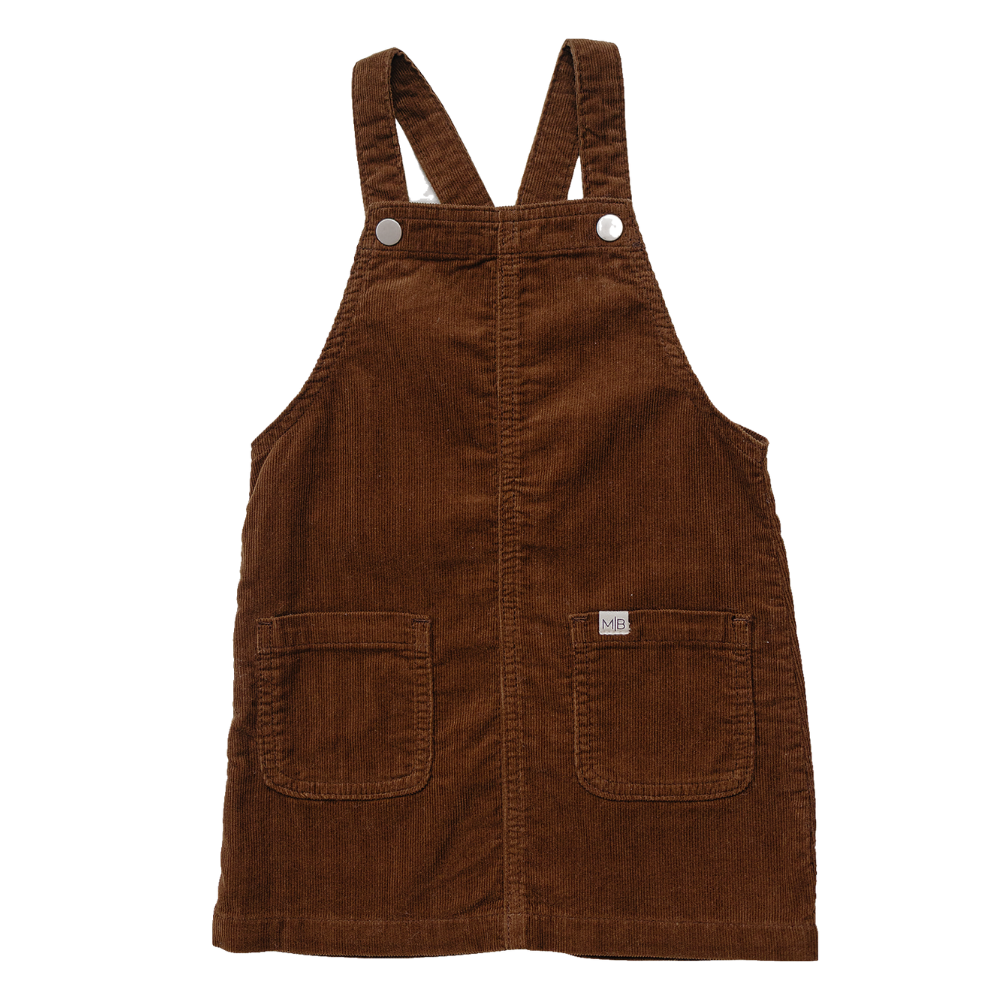 Brown corduroy pinafore dress with front pockets and a relaxed fit, shown against a plain background.