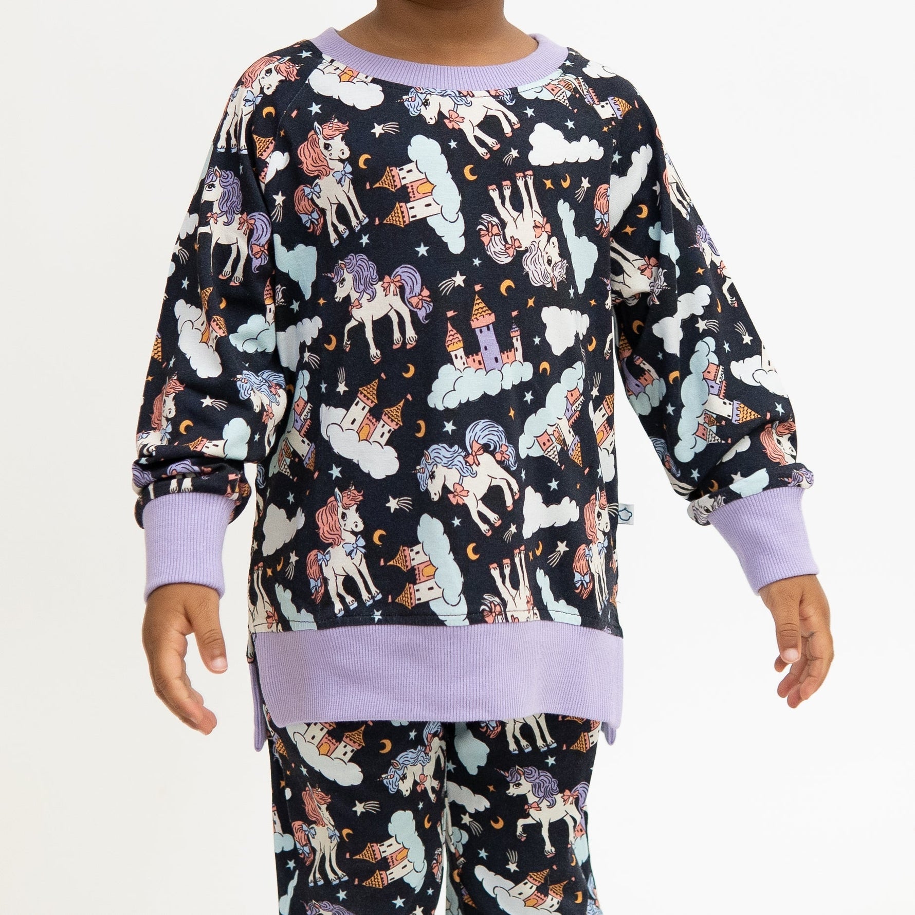 Toddler crew neck sweatshirt in a dark magical unicorn print.
