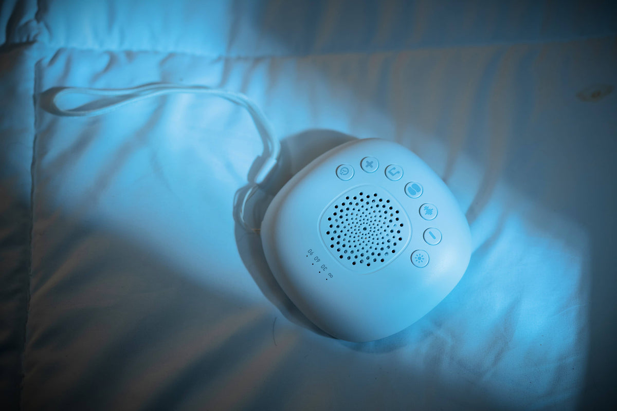 Sleeping Pal portable sound machine with night light and timer for babies.