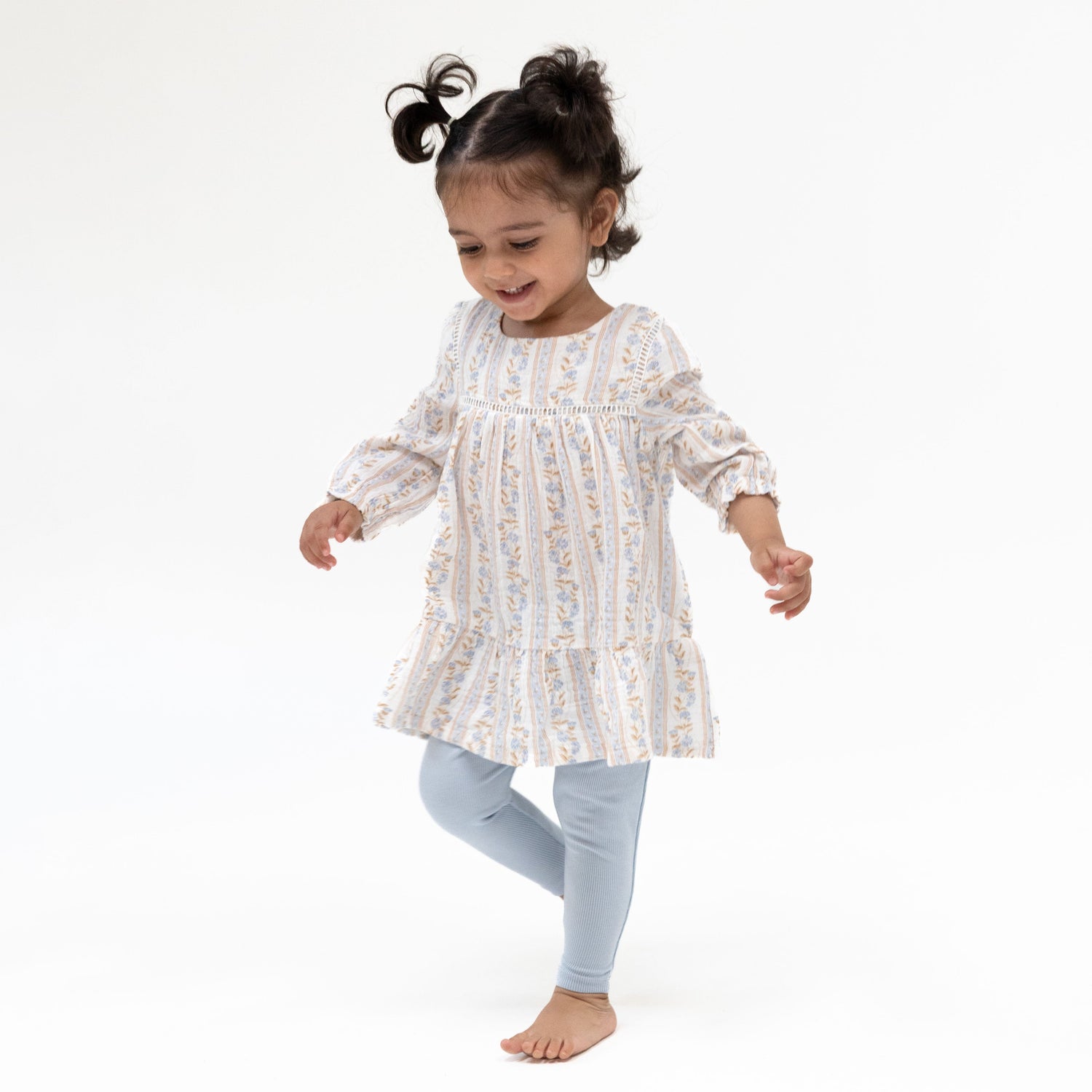 Floral puffed long-sleeve tiered dress with ladder trim, paired with matching ribbed leggings.