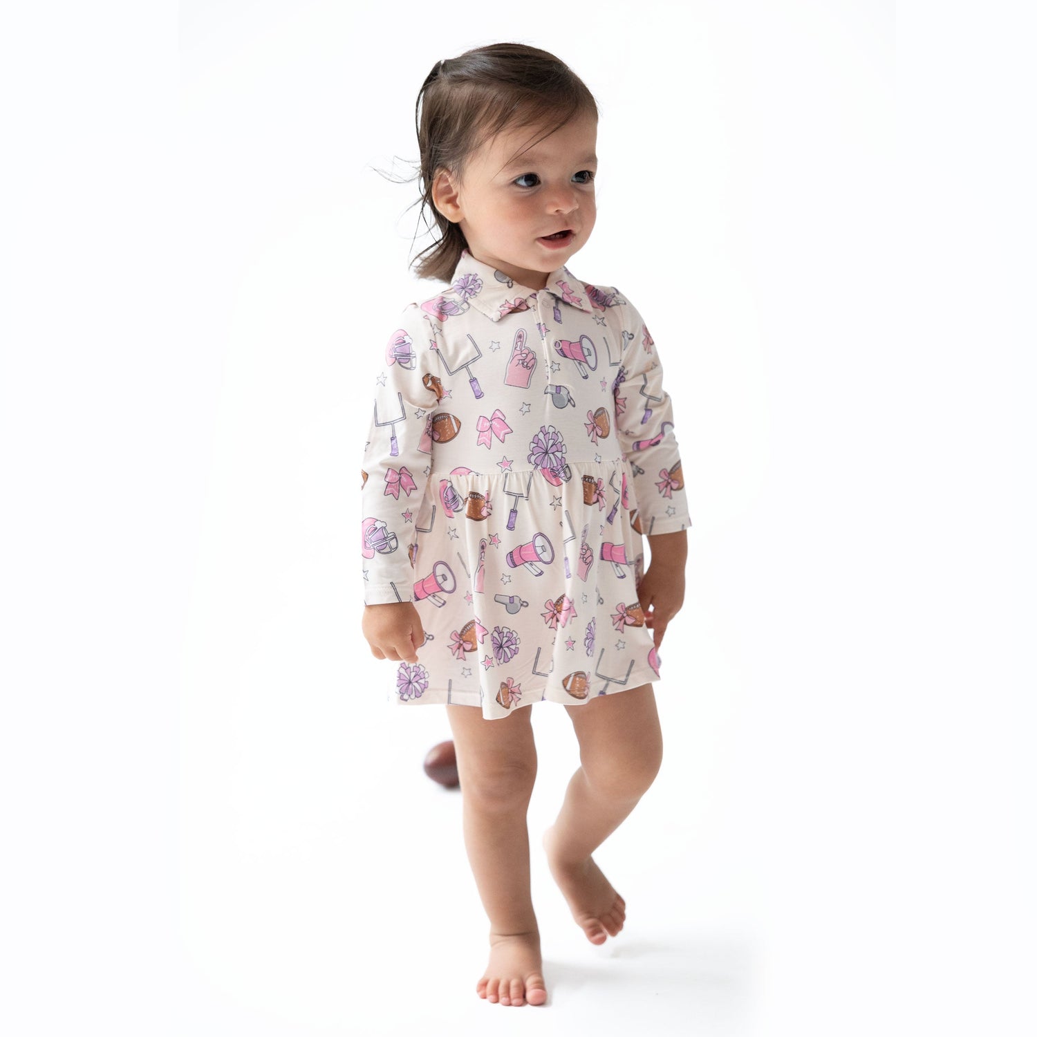 Long-sleeve bodysuit dress with a polo collar in a football cheer print, styled as a tennis dress silhouette.