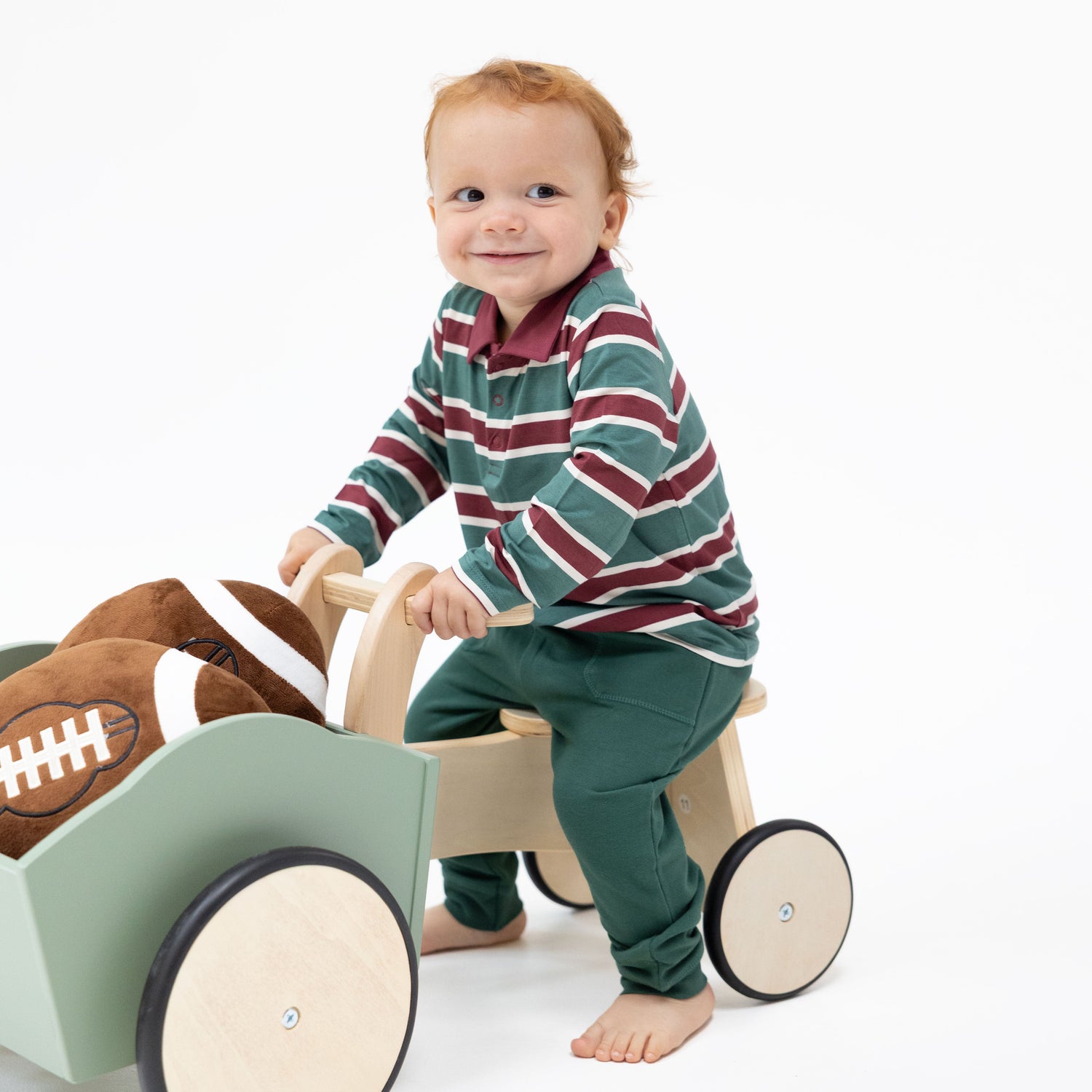 Green rugby stripe long sleeve polo shirt with collar and snap placket, paired with matching joggers.