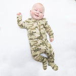 Baby footie pajamas in green and tan camouflage print with two-way zipper and footed legs