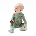 Footie pajamas with a print of footballs playing football, featuring a two-way front zipper and footed legs.