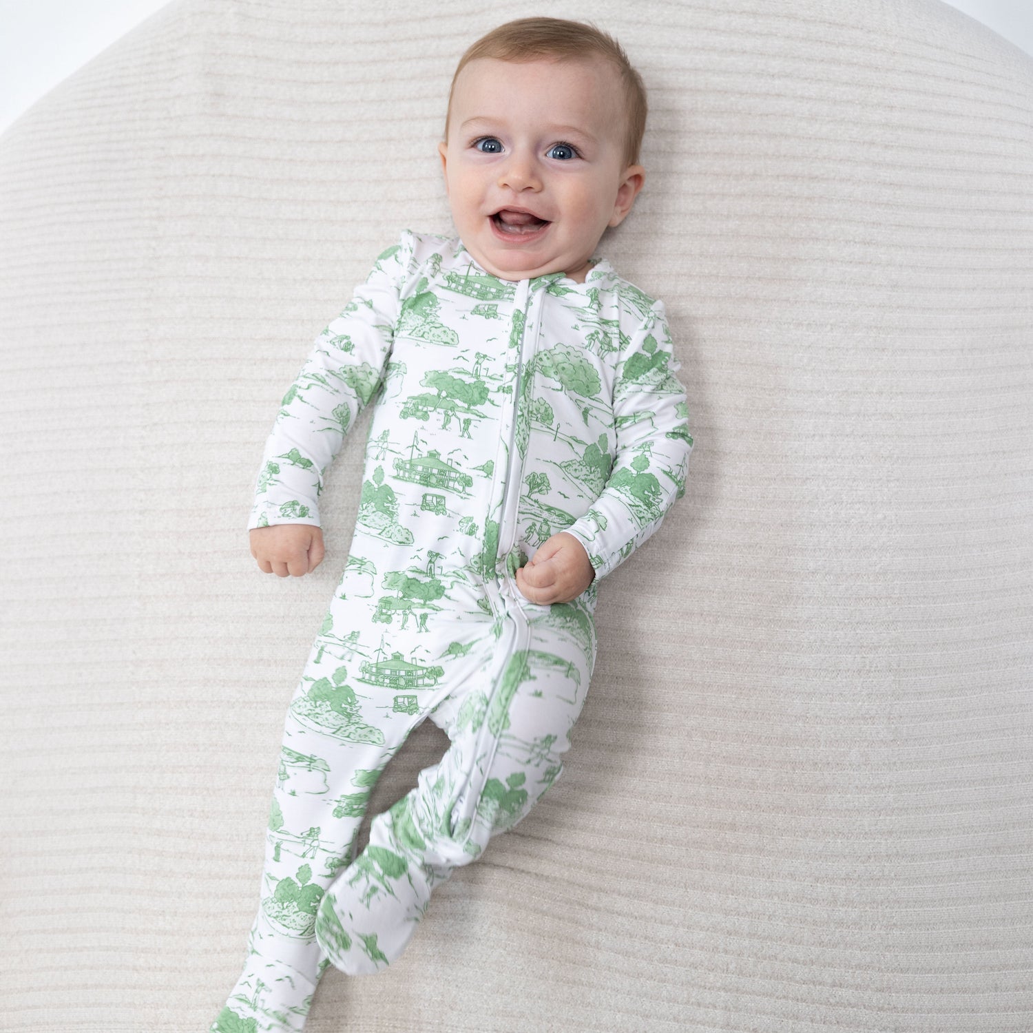 Baby footie pajamas in green golf toile print with two-way zipper and footed legs