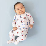 Baby footie pajamas with a hockey players print and full-length two-way zipper