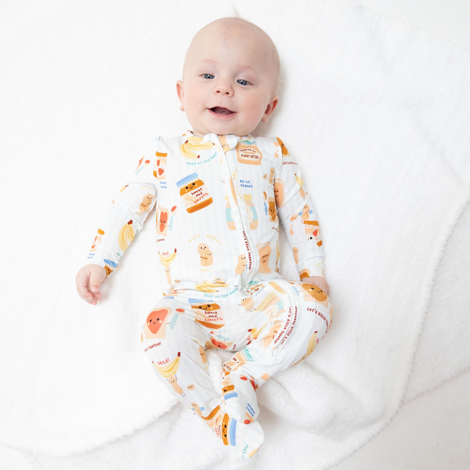 Footie pajamas in a heart print with a two-way zipper and gripper feet