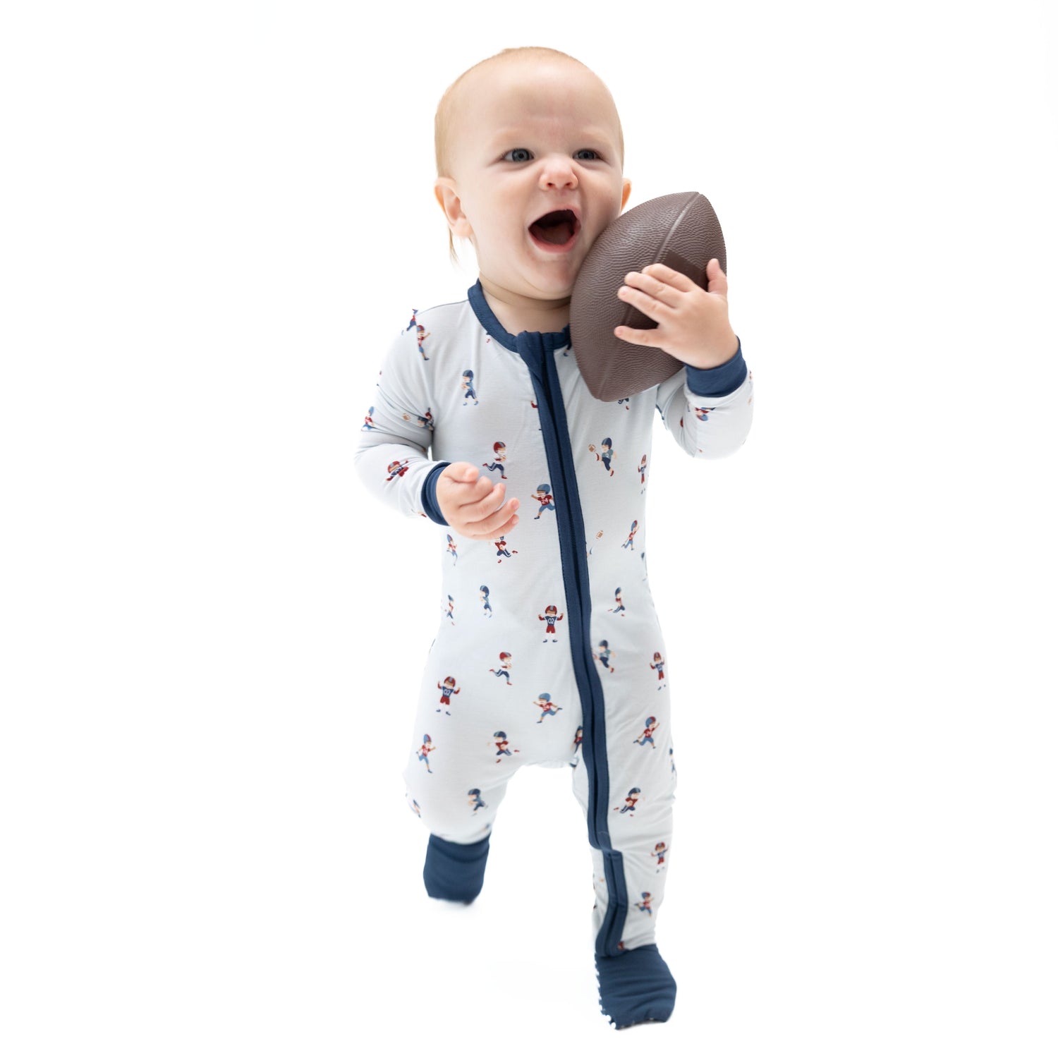 Convertible romper with a tiny footballers print, two-way zipper, and foot grippers