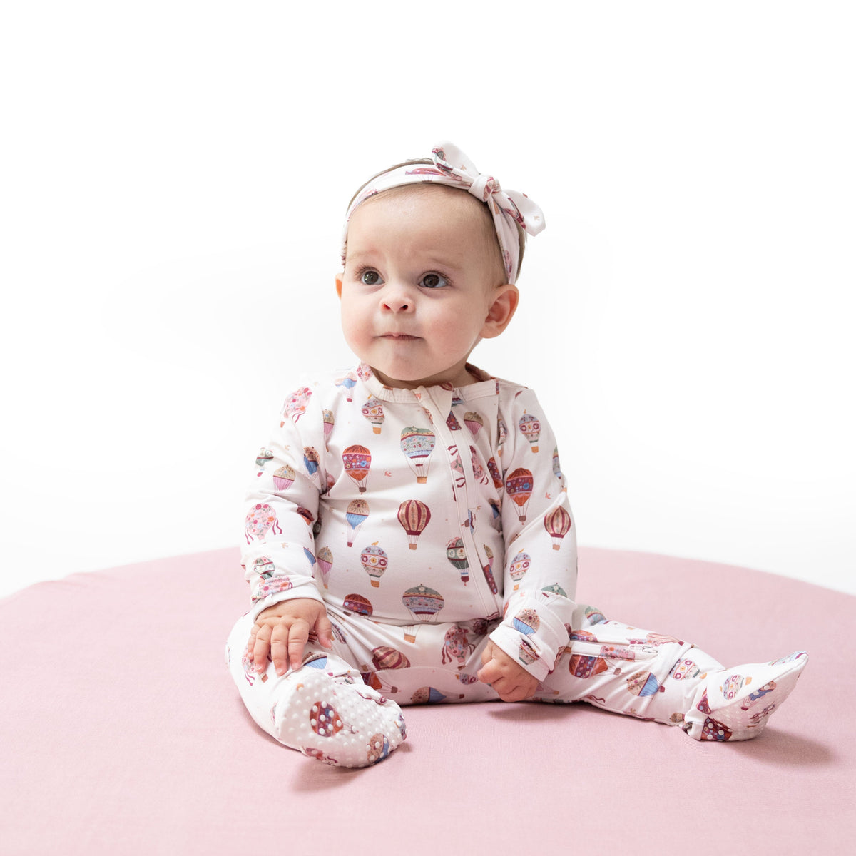Baby footie pajamas with hot air balloon print, two-way zipper front, fold-over cuffs and footed grippers