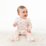 Footie pajamas in a rose bow lattice print with a ruffle back detail and full-length zipper