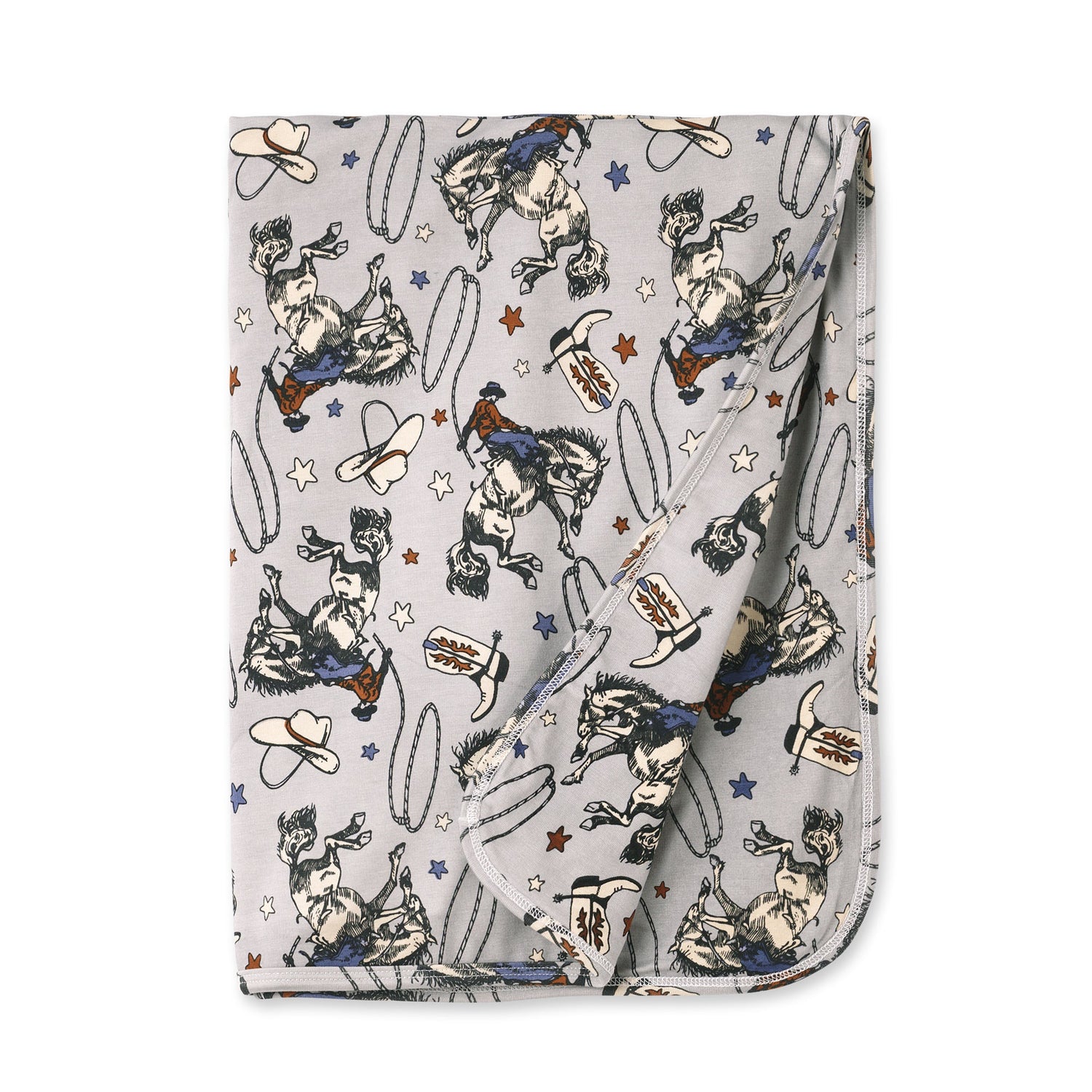 Stroller blanket with a Western rodeo print of bucking broncos, cowboy hats, and lassos on a light background.
