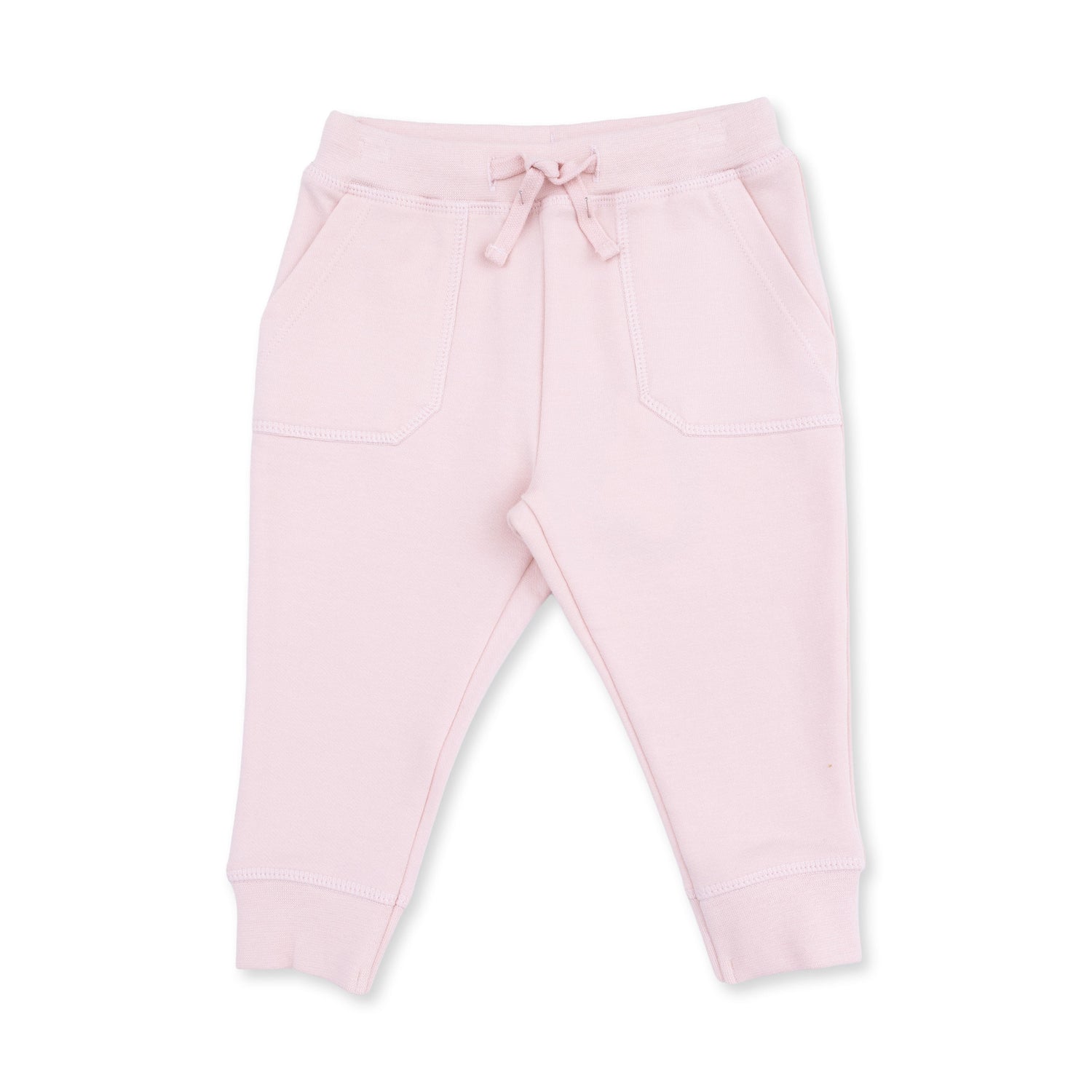 French terry jogger pants in soft veiled pink with a drawstring waist and snug ankle cuffs