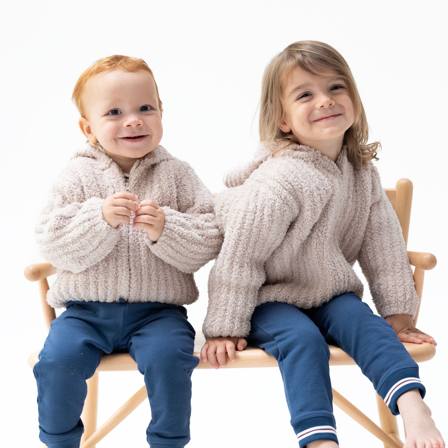 Stone chenille hooded baby jacket with striped texture, full zip front, and side pockets.