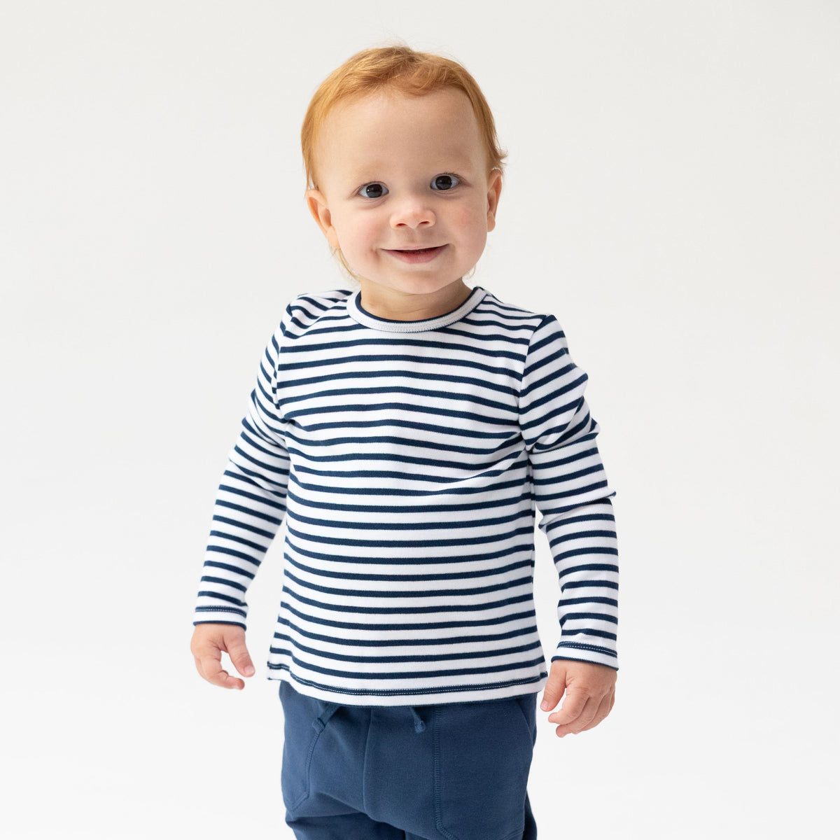 Long sleeve baby and toddler shirt in navy and white stripes with plain crew neckline