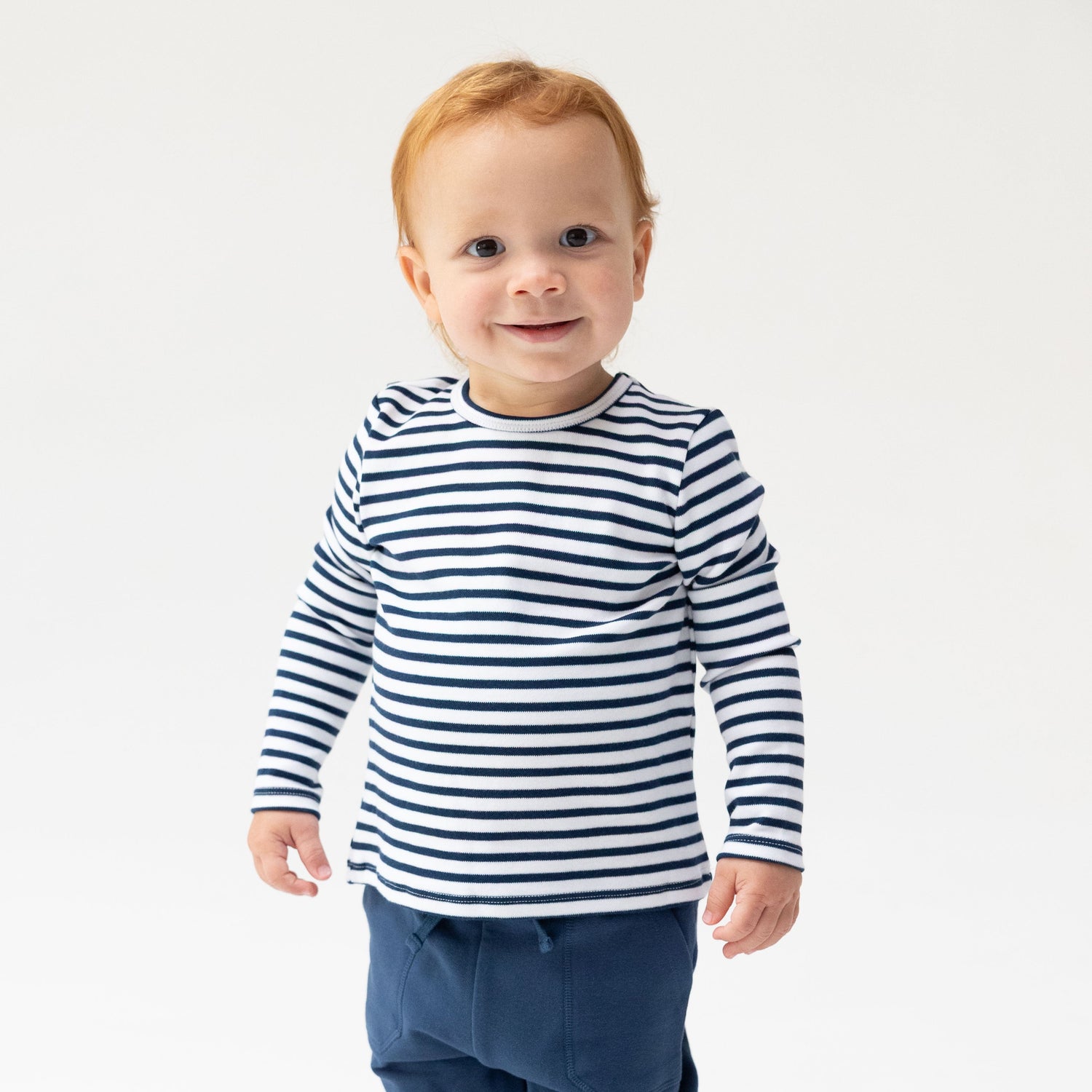Long sleeve baby and toddler shirt in navy and white stripes with plain crew neckline