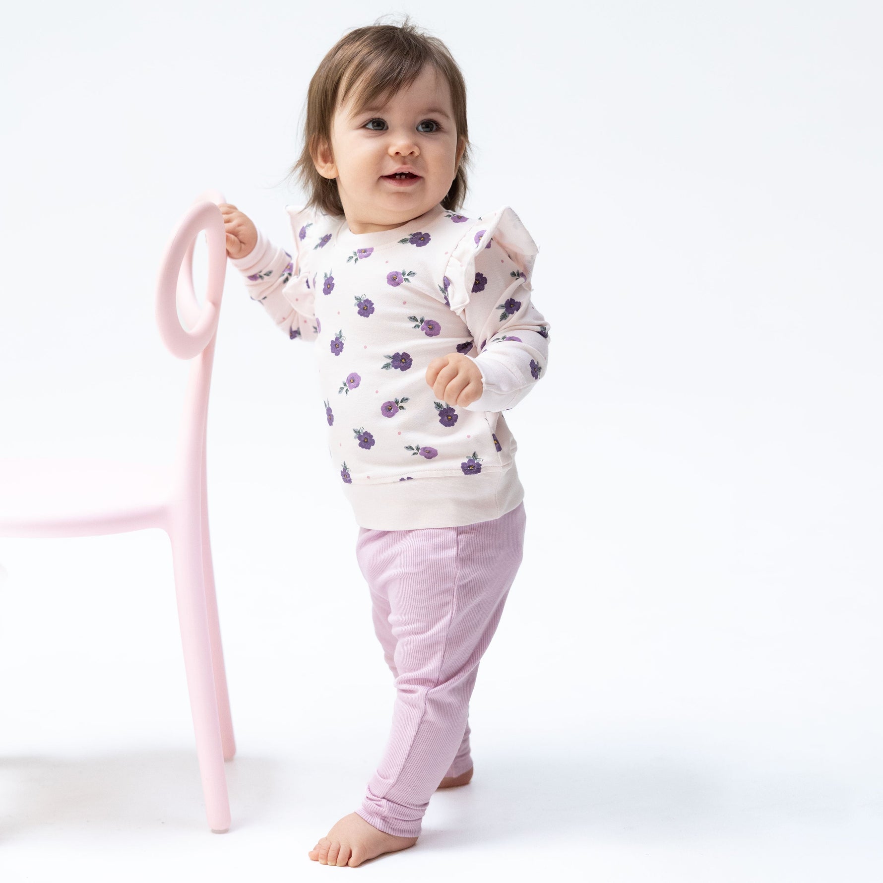Baby two-piece set with violet floral print ruffle sweatshirt and matching ribbed leggings