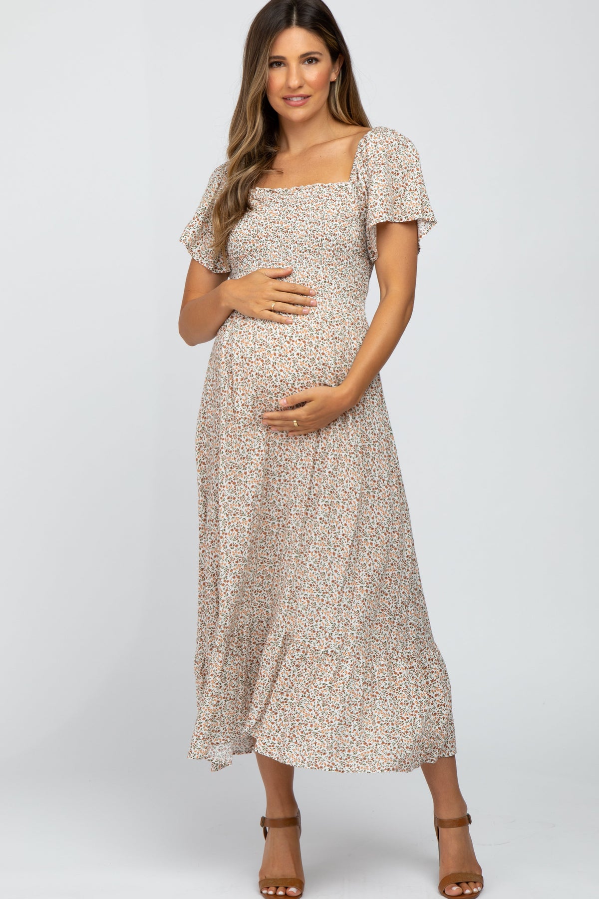 Ivory Floral Smocked Maternity Maxi Dress by PinkBlush (view 1 of 29)