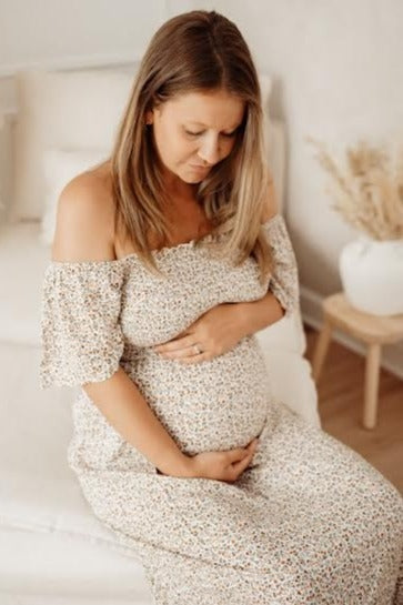 Ivory Floral Smocked Maternity Maxi Dress by PinkBlush (view 25 of 29)