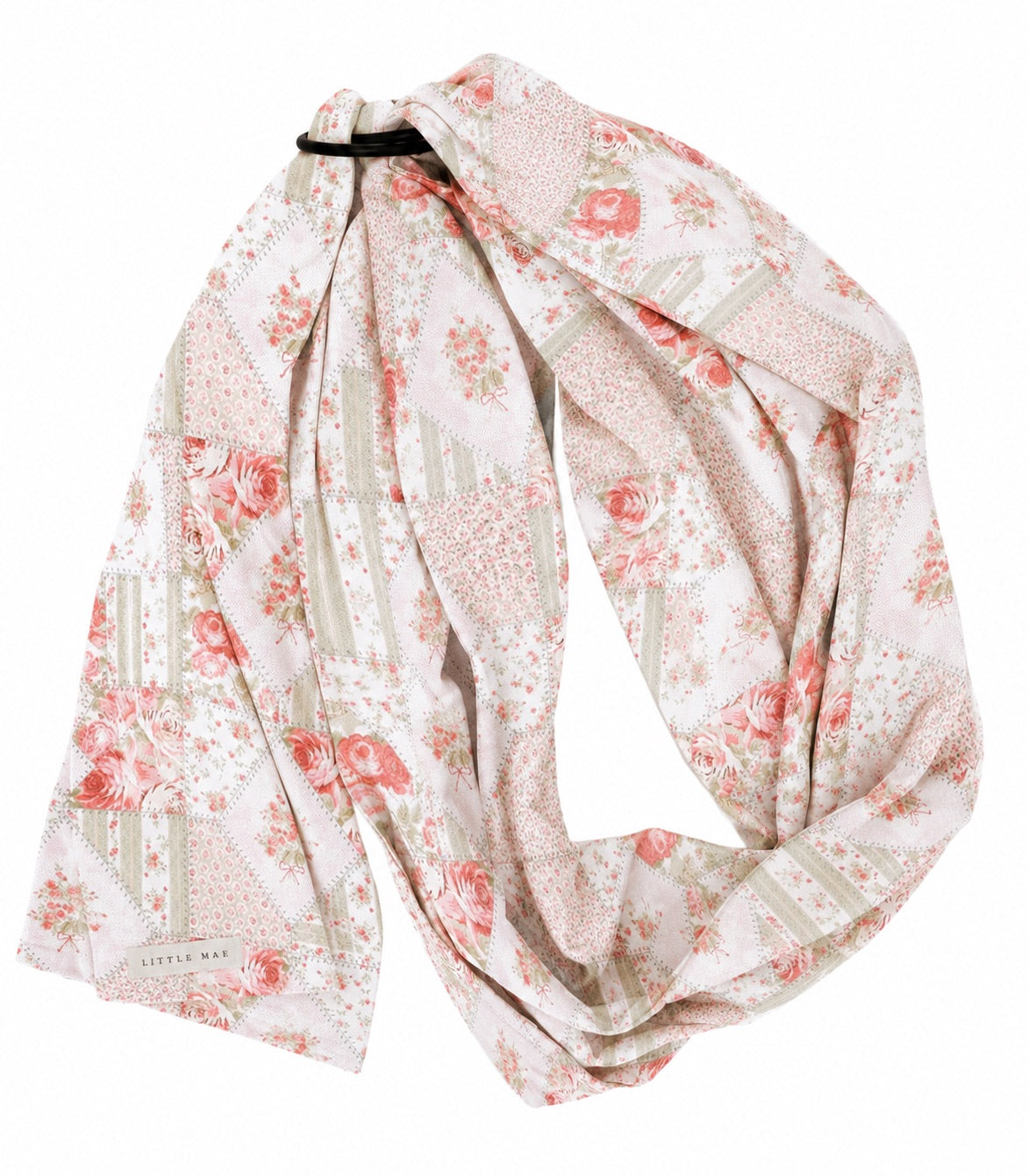 Pink and green patch print ring sling baby carrier with two aluminum rings holding the fabric