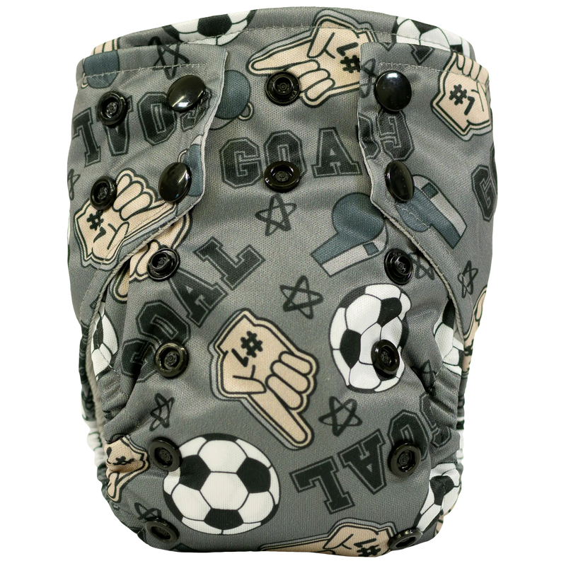 Tiny Tushies Newborn AIO cloth diaper with soccer theme design and snaps.