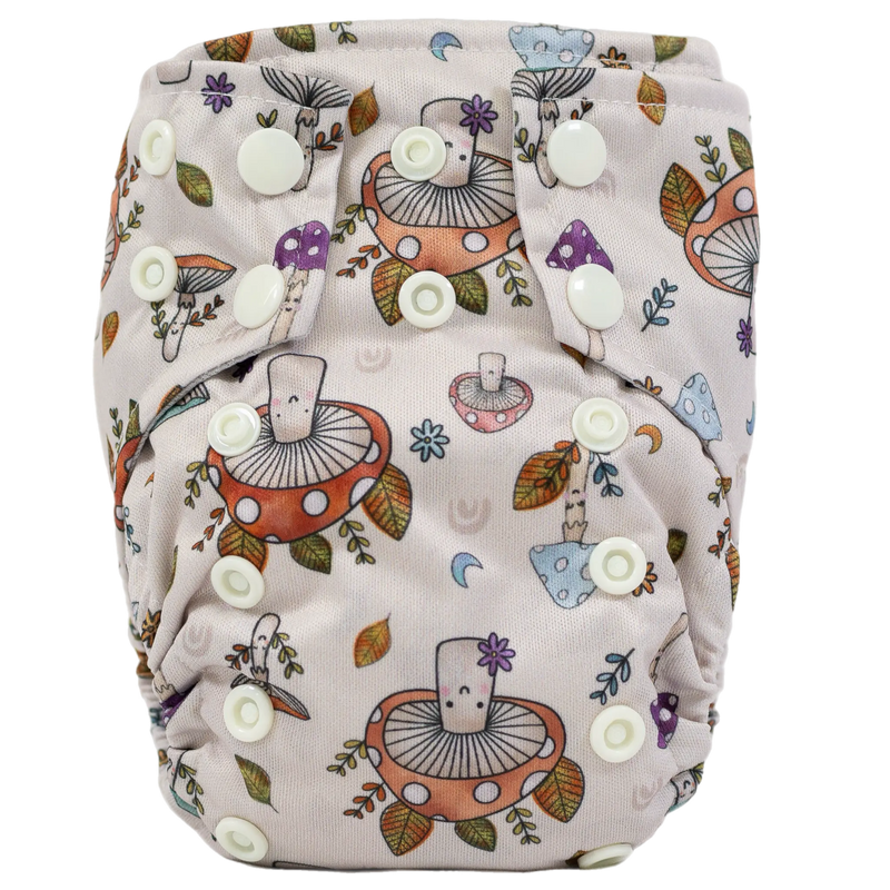 Tiny Tushies Newborn AIO Cloth Diaper with mushroom print and multiple snap closures.