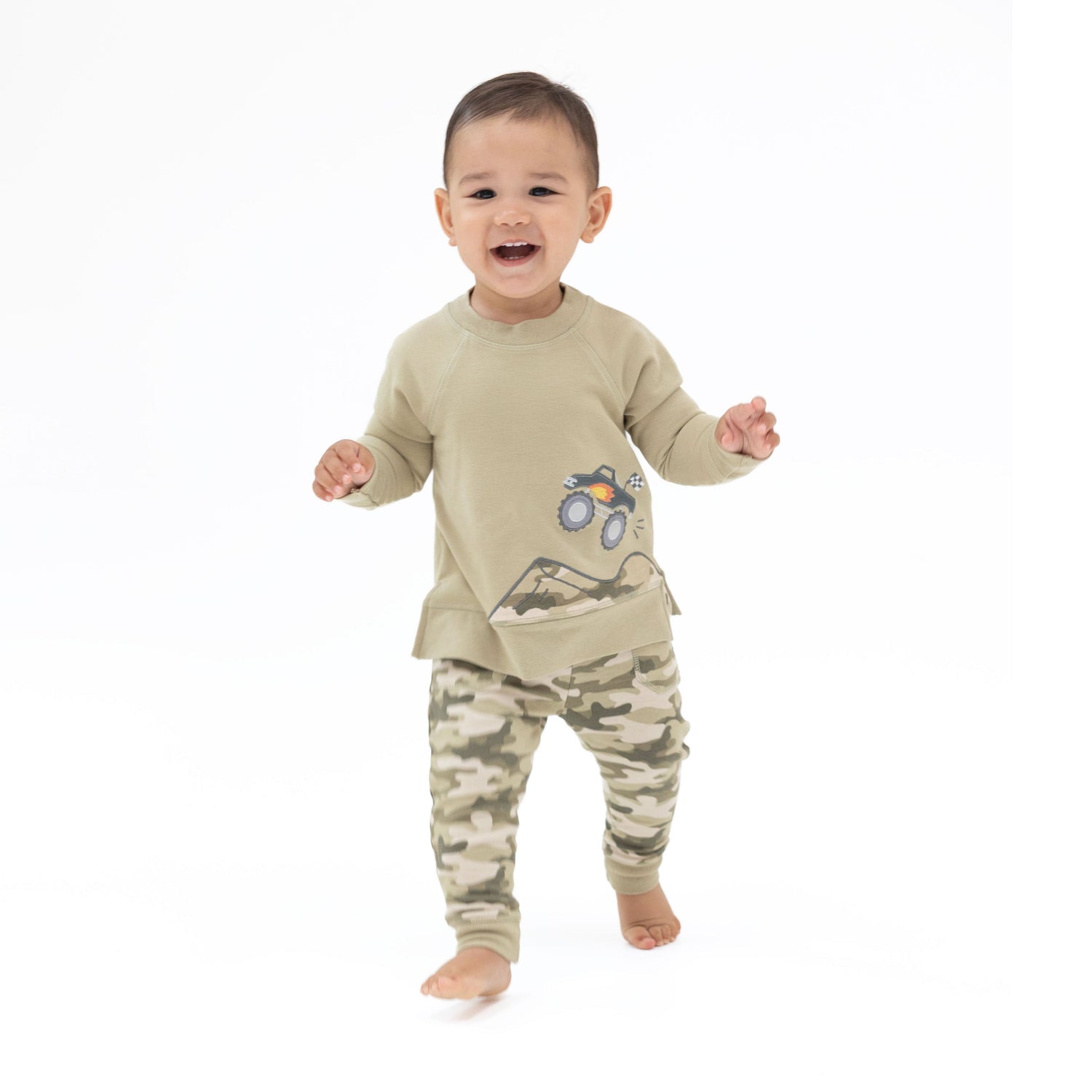 Sweatshirt in camo French terry with a monster truck applique above camo mountains and raglan drop sleeves.