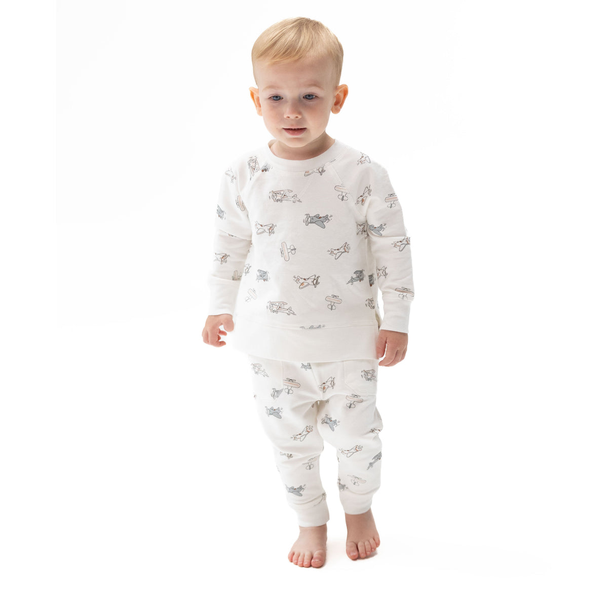 Baby jogger pants in a vintage airplane pilot print with drawstring waist and cuffed ankles.