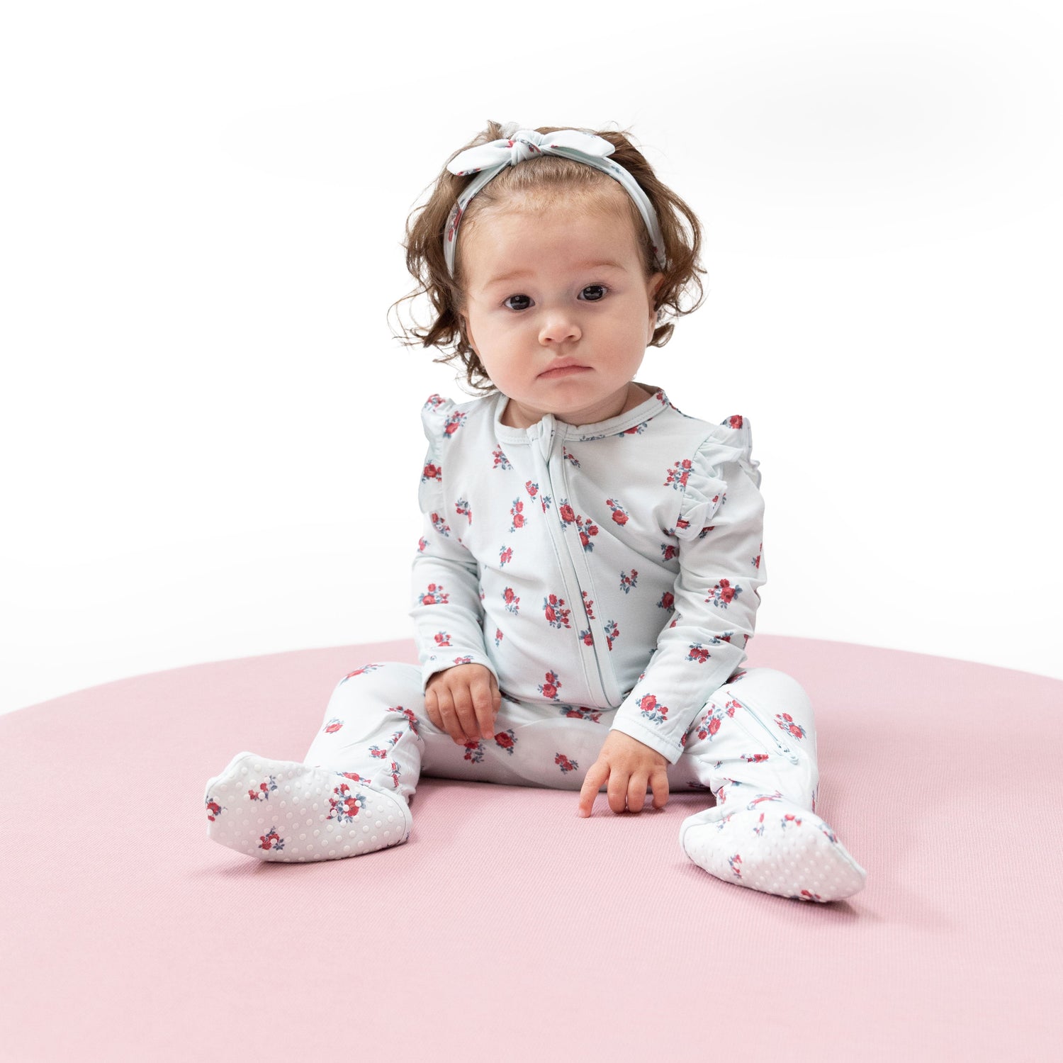 Ruffle-sleeve zipper footie in Alyssa Floral print with fold-over cuffs and footed grippers.