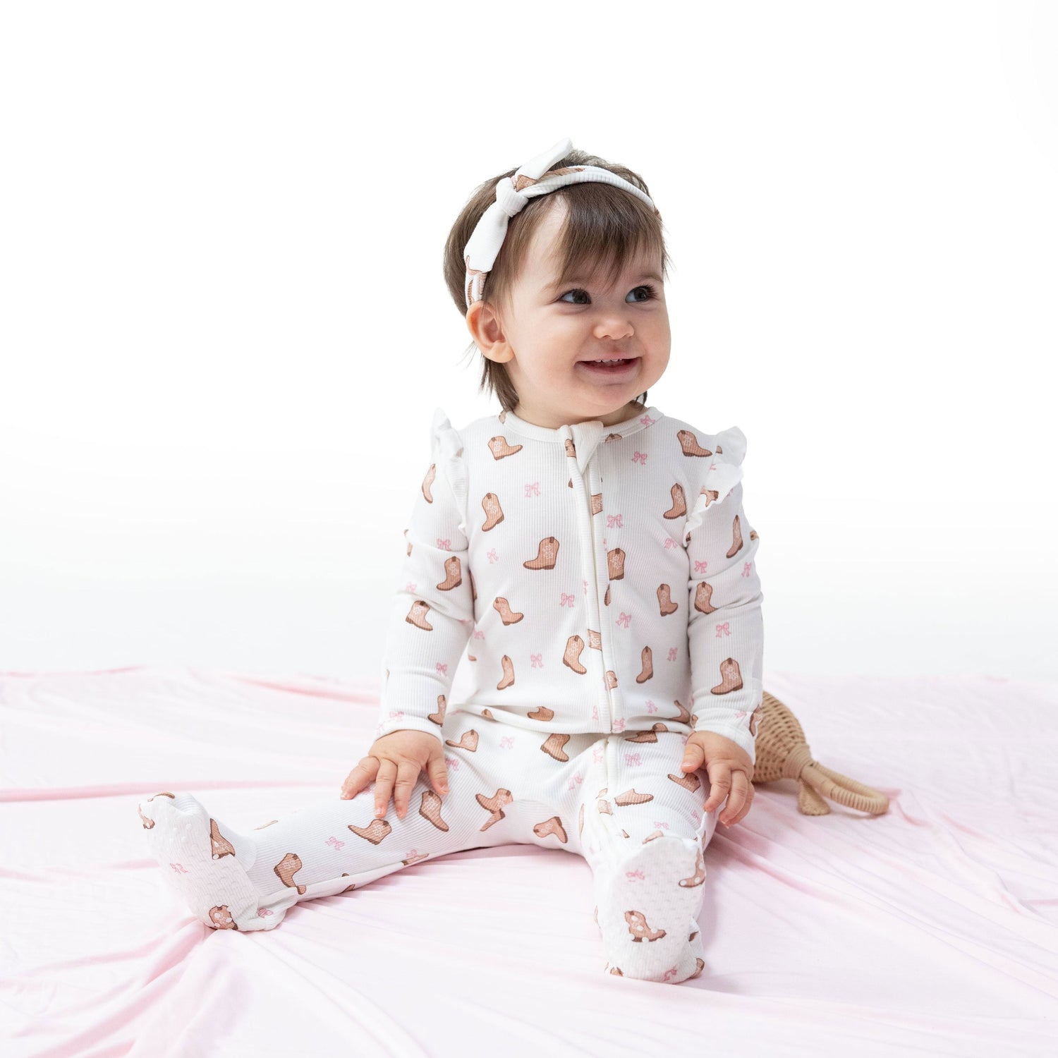 Ruffle-sleeve zipper footie in a mini cowgirl boots print with fold-over cuffs and footed grippers