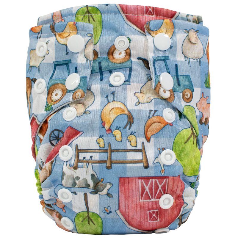 Tiny Tushies Newborn AIO Cloth Diaper with farm animal print and adjustable snaps.