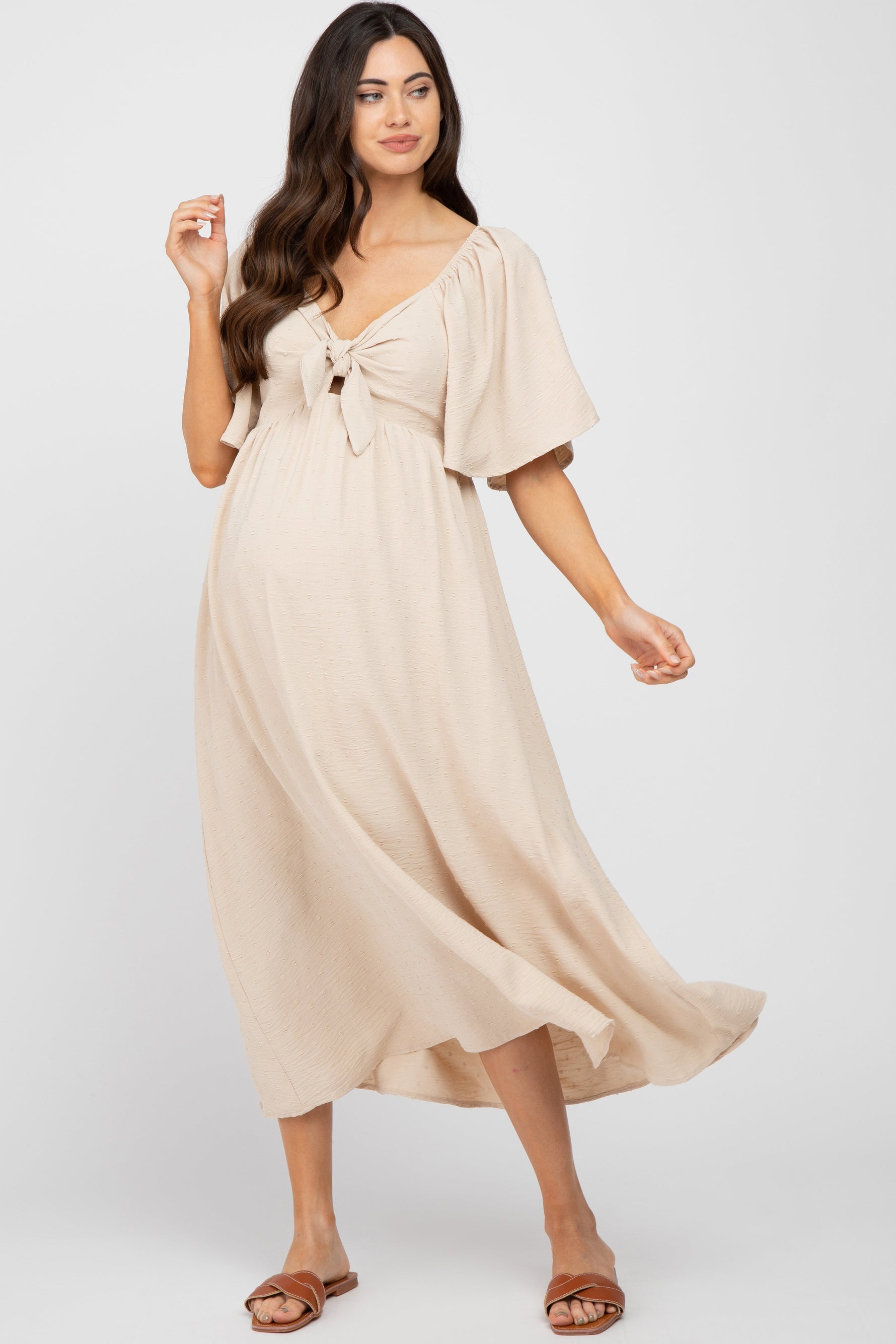Textured Dot Front Tie Ruffle Sleeve Maternity Dress by PinkBlush (view 1 of 8)