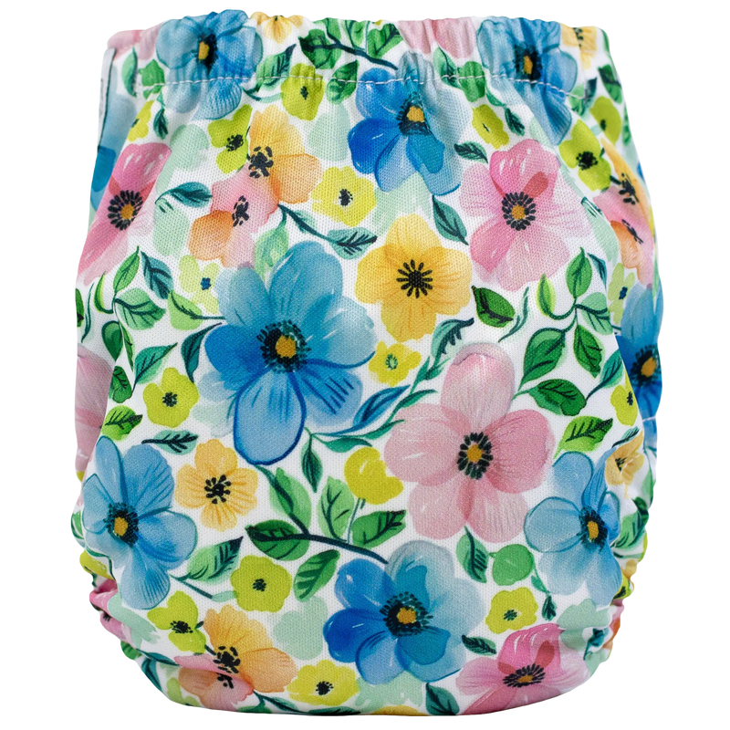 Tiny Tushies Newborn AIO Cloth Diaper with floral print and pocket opening.