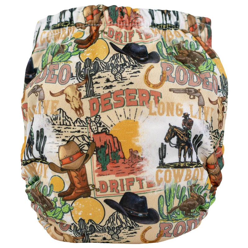 Tiny Tushies Newborn AIO cloth diaper with cowboy and desert print design.