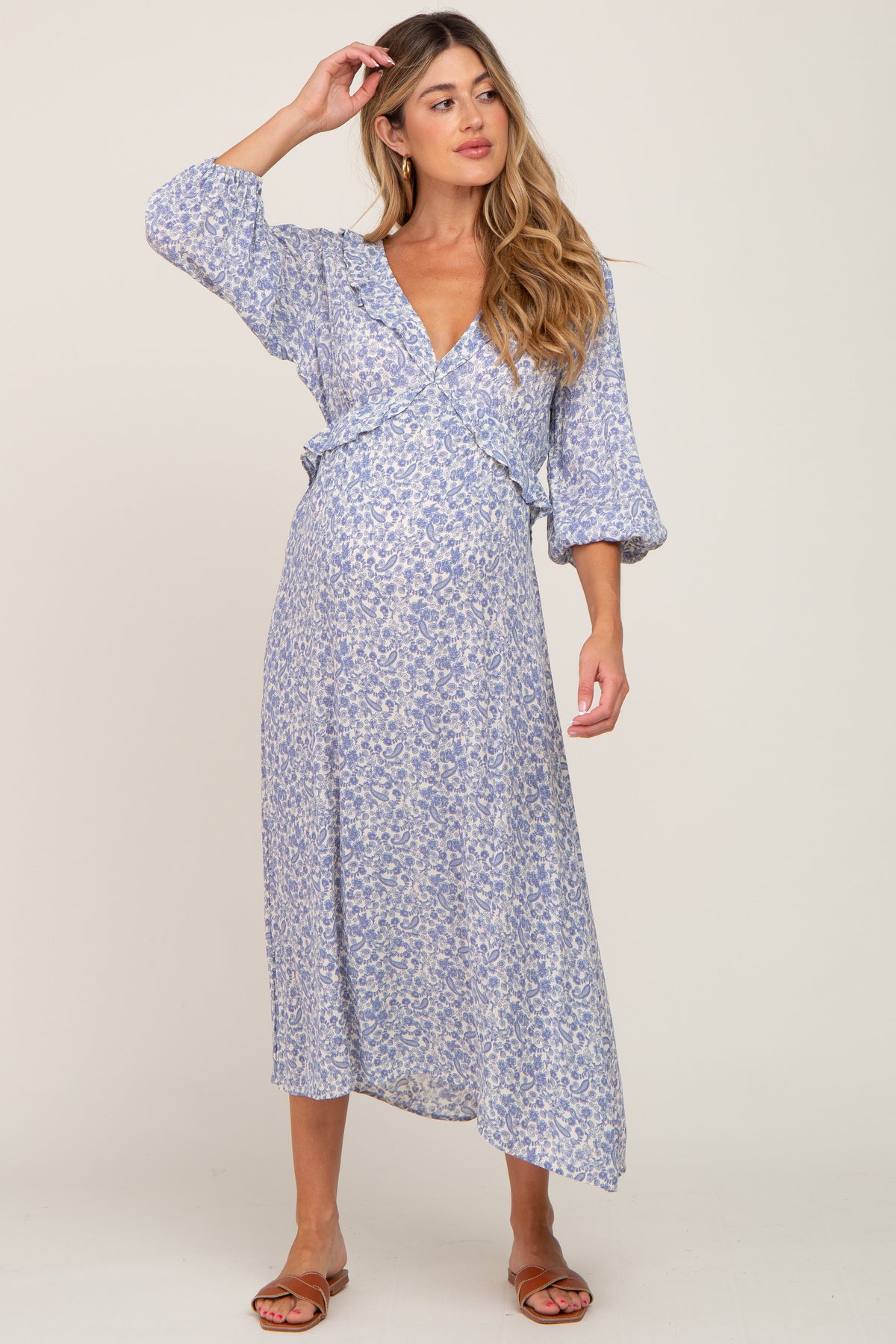 Blue floral maternity midi dress with ruffle trim and a V-neckline