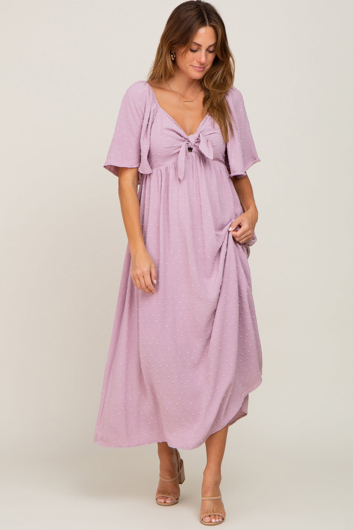 PinkBlush pink textured dot front tie ruffle sleeve maternity midi dress.