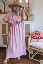 Pink textured dot maternity midi dress, front tie, ruffle sleeves.