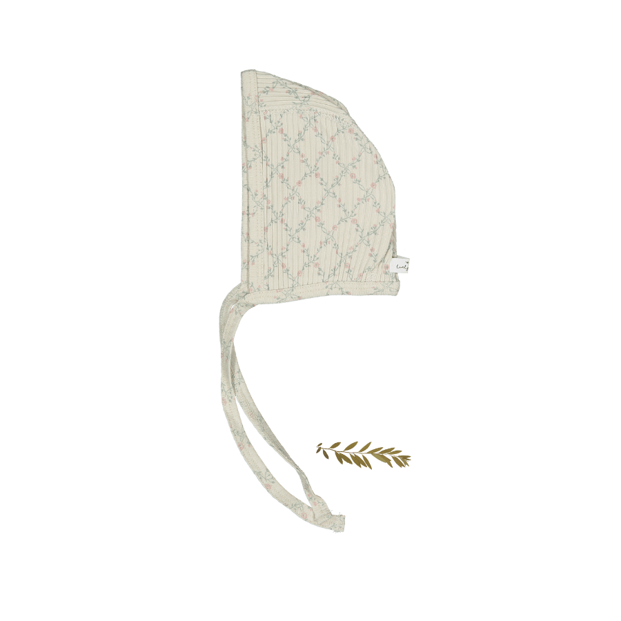 Baby bonnet in a pink lattice print with ties at the chin