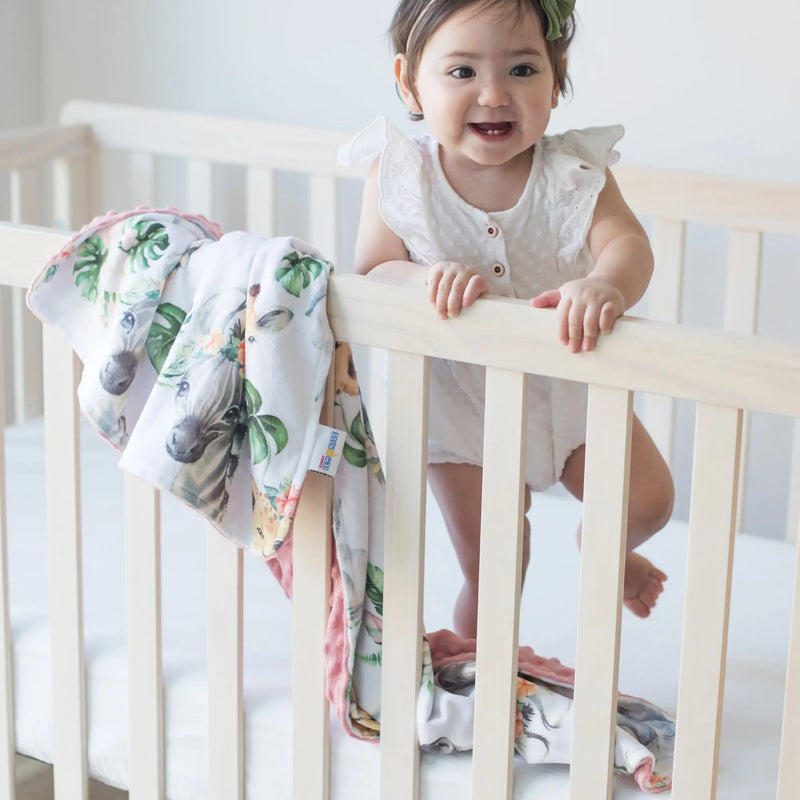 Baby & Toddler Minky Blanket with Africa Animals print in crib.
