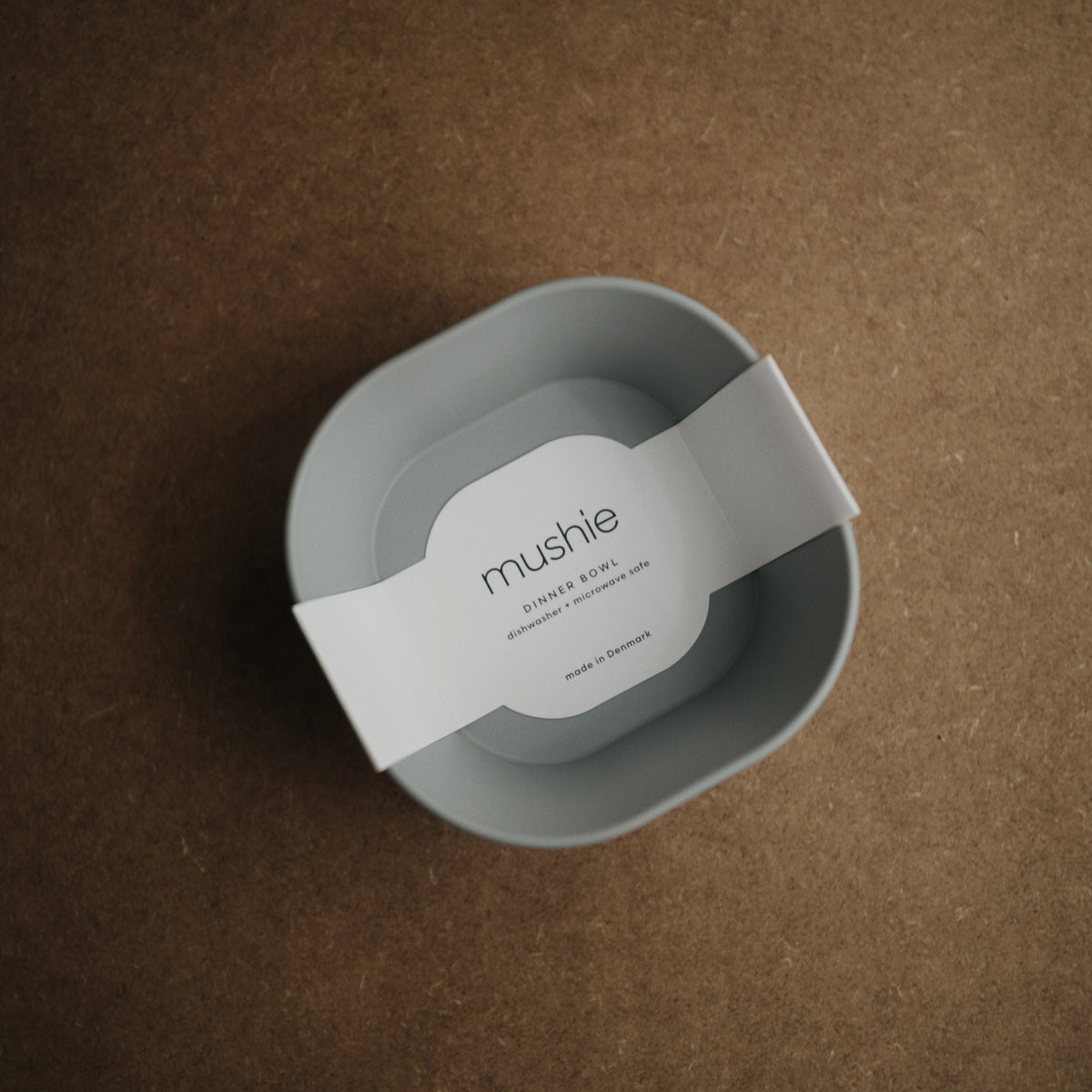 Mushie square silicone baby feeding bowls.