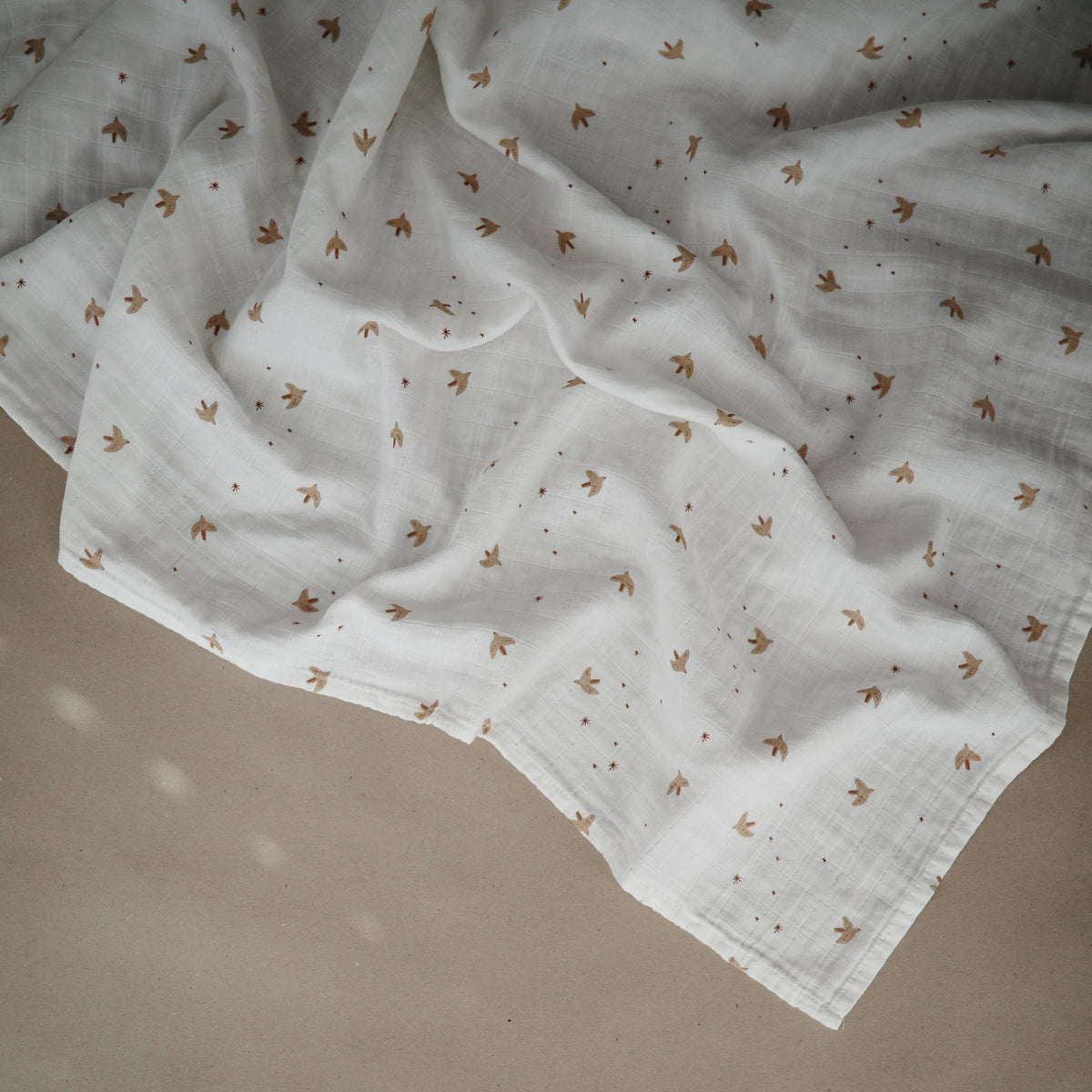 Mushie organic cotton muslin baby swaddle blanket